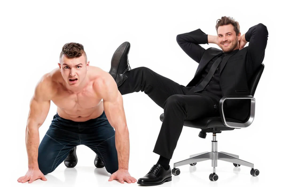 Human Furniture Symbolbild: Ein Mann sitzt auf einem Bürostuhl und benutzt einen anderen Mann mit nacktem Oberkörper als Tisch, um seine Beine darauf abzulegen. Human Furniture Symbolic image: A man sits on an office chair and uses another man with a bare chest as a table to rest his legs on.